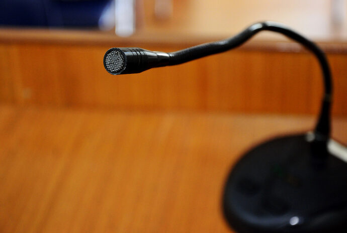 Author reading microphone